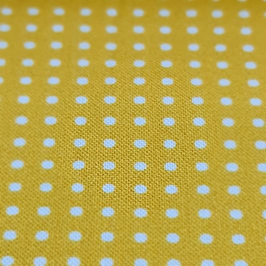 Tela amarilla topito blanco 5