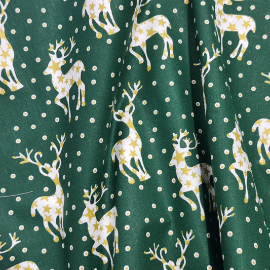 Tejido con renos color dorado y blanco.