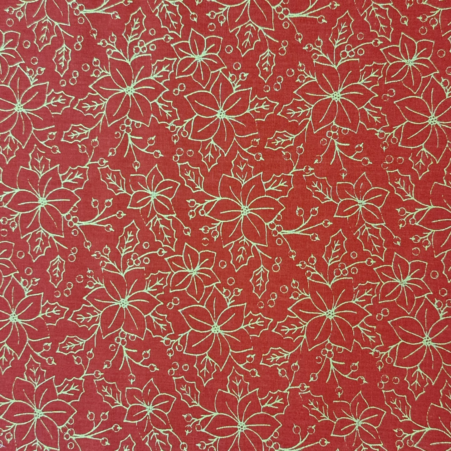 Tejido de flor navideña color dorado.